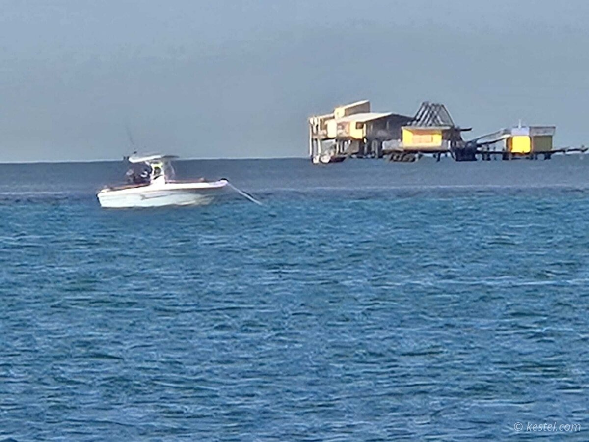 Boat near Stiltsville structures in Biscayne Bay